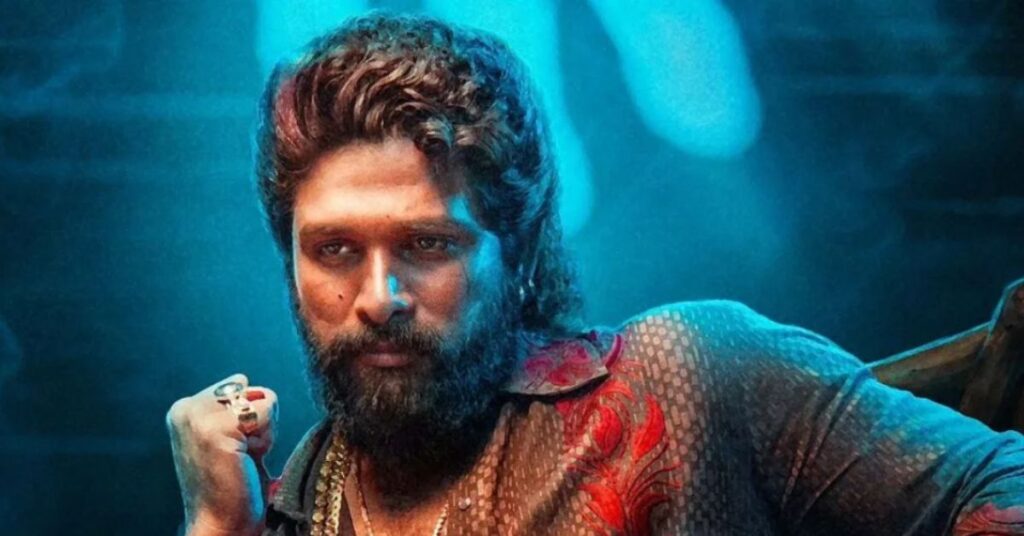 Allu Arjun intense look with beard and stylish outfit in dramatic blue lighting